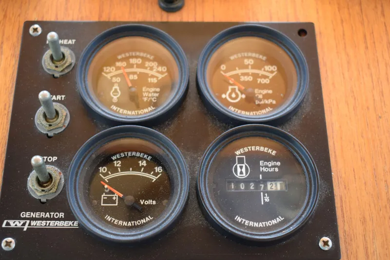 Slide: The Image of Control panel of a 1980 Cheoy Lee 52 Motorsailer with Westerbeke gauges. - 48