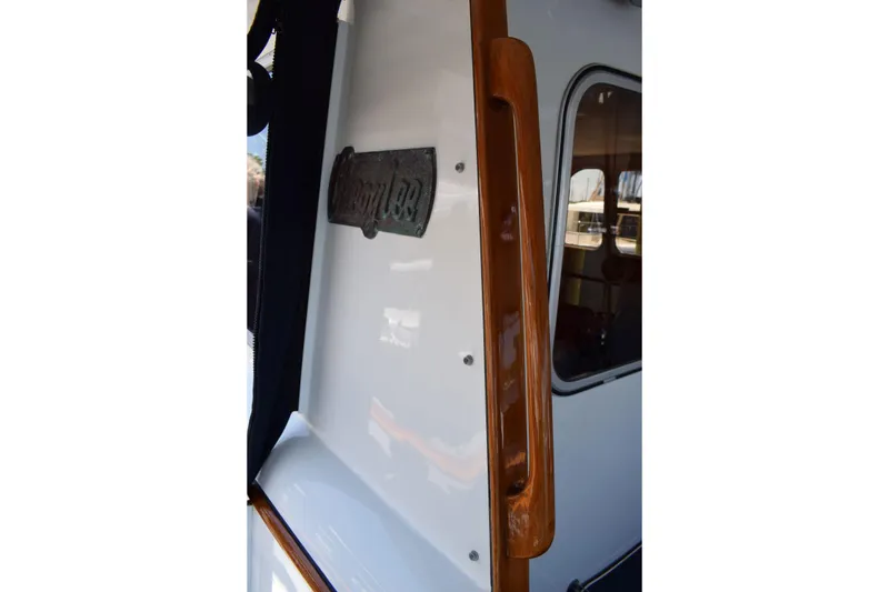 Slide: The Image of 1980 Cheoy Lee 52 Motorsailer with polished wood handle and nameplate. - 39