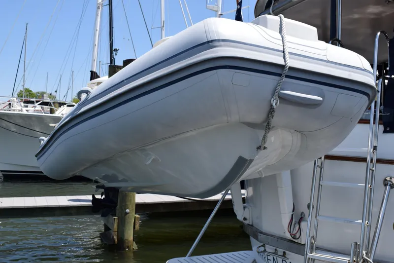 Slide: The Image of Inflatable dinghy on a 1980 Cheoy Lee 52 Motorsailer, docked at a marina. - 33