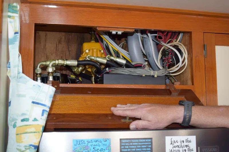 Slide: The Image of Electrical wiring and components inside a 1980 Cheoy Lee 52 Motorsailer cabinet. - 61