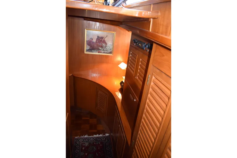 Slide: The Image of Interior of 1980 Cheoy Lee 52 Motorsailer with wooden cabinetry and nautical decor. - 85