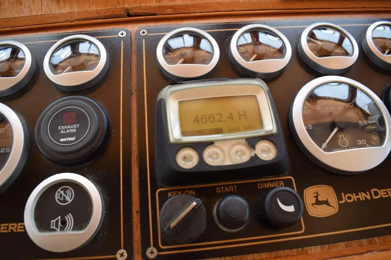 Slide: The Image of Instrument panel of a 1980 Cheoy Lee 52 Motorsailer with gauges and controls. - 53