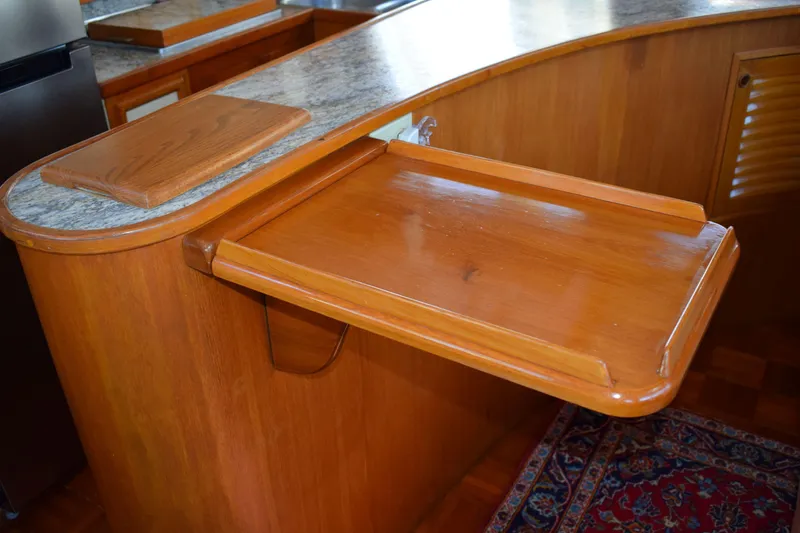Slide: The Image of Wooden interior detail of 1980 Cheoy Lee 52 Motorsailer yacht with foldable table. - 63