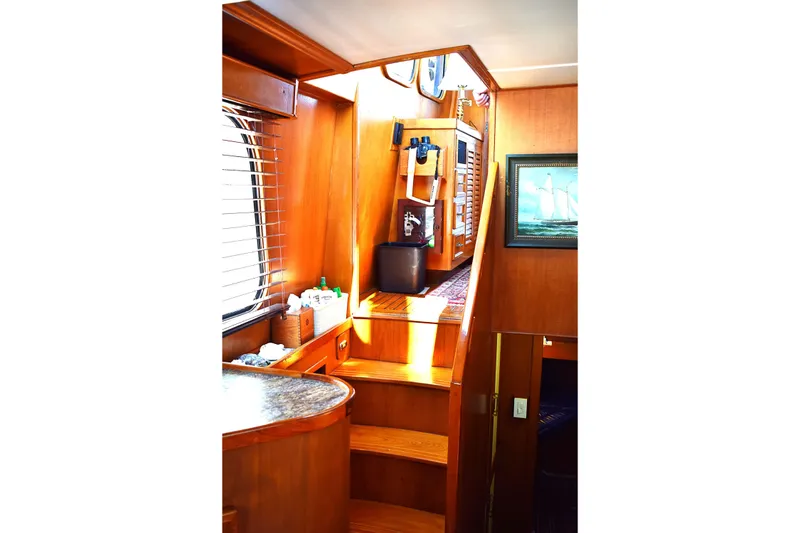 Slide: The Image of Interior of 1980 Cheoy Lee 52 Motorsailer with wooden stairs and nautical decor. - 59
