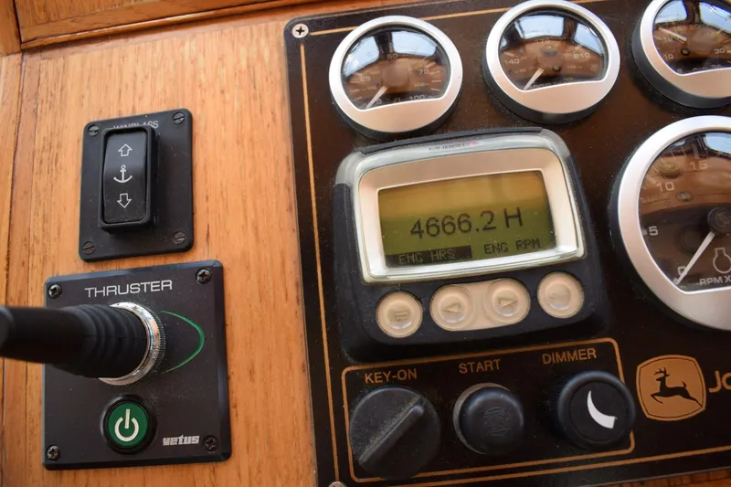 Slide: The Image of Control panel of a 1980 Cheoy Lee 52 Motorsailer, showing engine hours and gauges. - 52