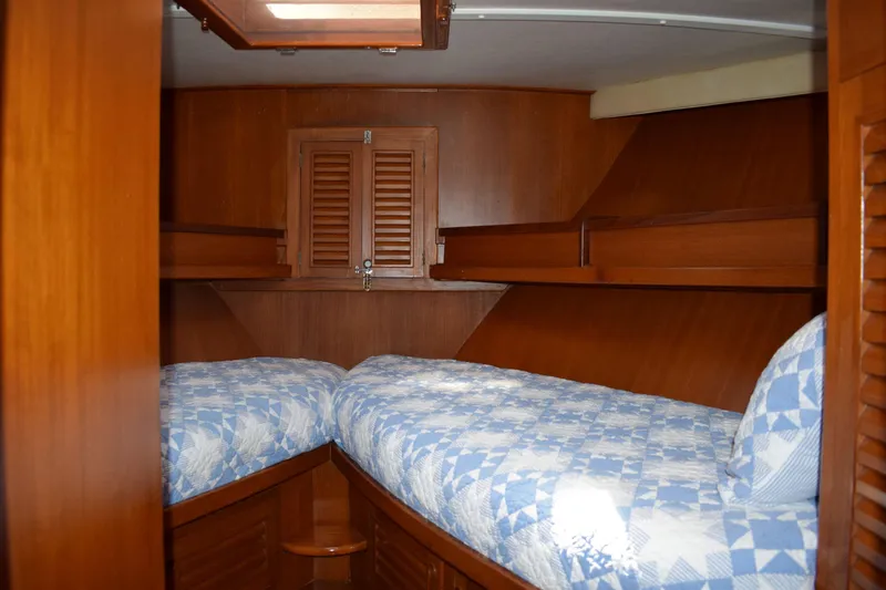 Slide: The Image of Interior cabin of 1980 Cheoy Lee 52 Motorsailer with twin beds and wooden finish. - 80
