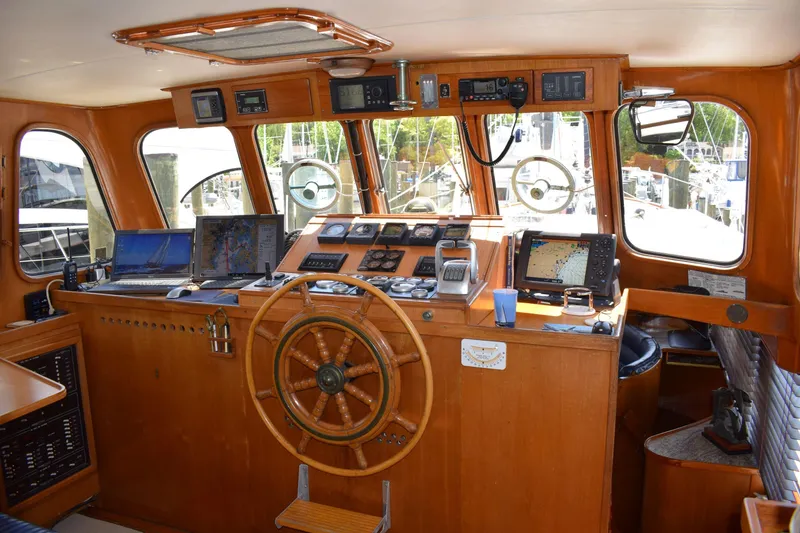 Slide: The Image of Interior of 1980 Cheoy Lee 52 Motorsailer with wooden helm and navigation equipment. - 41