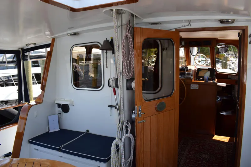 Slide: The Image of Interior view of 1980 Cheoy Lee 52 Motorsailer, featuring wooden door and nautical decor. - 40