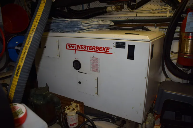 Slide: The Image of Engine room of 1980 Cheoy Lee 52 Motorsailer with Westerbeke generator. - 97