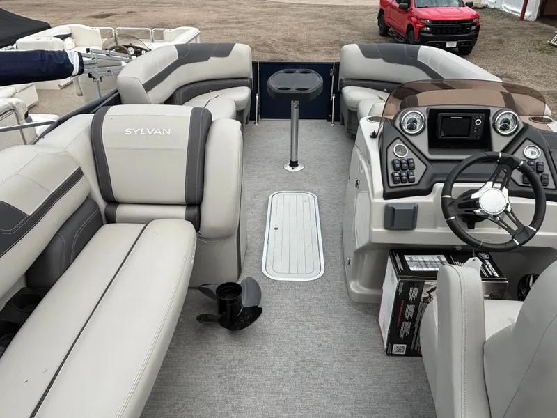Slide: The Image of The image shows the interior of a 2021 Sylvan L3PF TRITOON with gray seating and a helm station. - 7