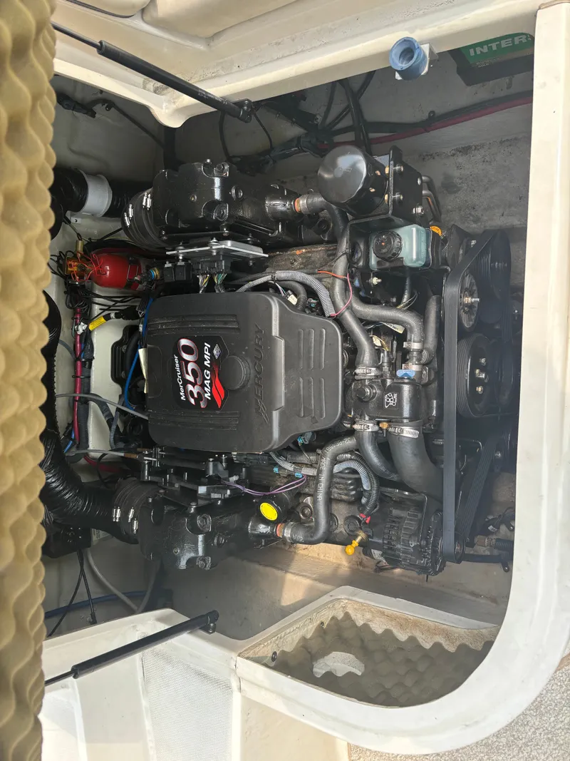 Slide: The Image of The engine compartment of a 2005 Sea Ray 240 Sundeck with a 350 Mag MPI engine. - 16