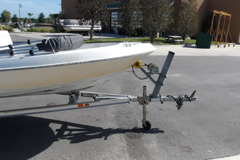 Slide: The Image of 2002 Wellcraft 160 Fisherman boat on trailer in parking lot. - 10