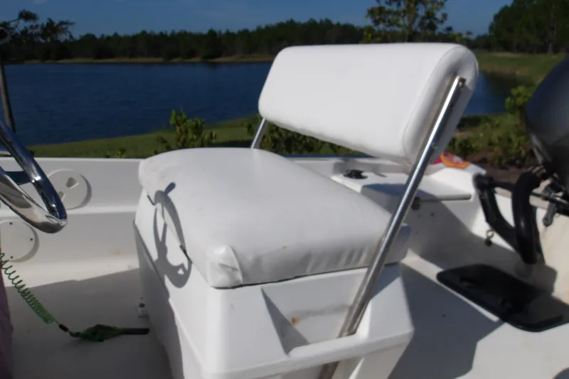 Slide: The Image of 2002 Wellcraft 160 Fisherman boat seat with lake view in background. - 12