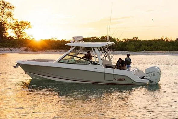 Slide: The Image of Manufacturer Provided Image: 2026 Boston Whaler 280 Vantage boat cruising at sunset on calm waters. - 4