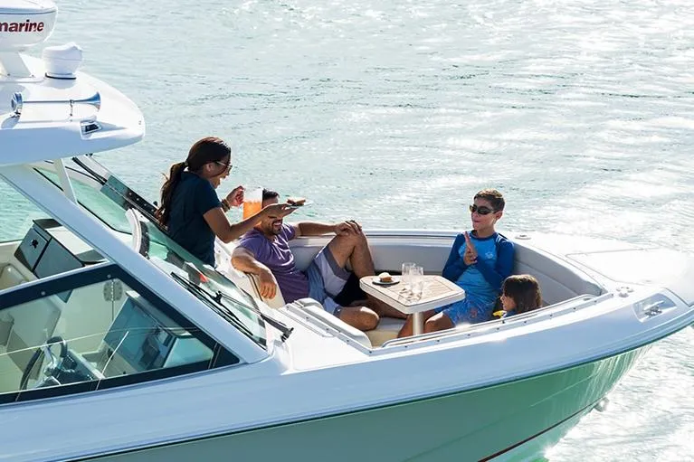 Slide: The Image of Manufacturer Provided Image: 2026 Boston Whaler 280 Vantage with people relaxing on deck in sunny waters. - 5