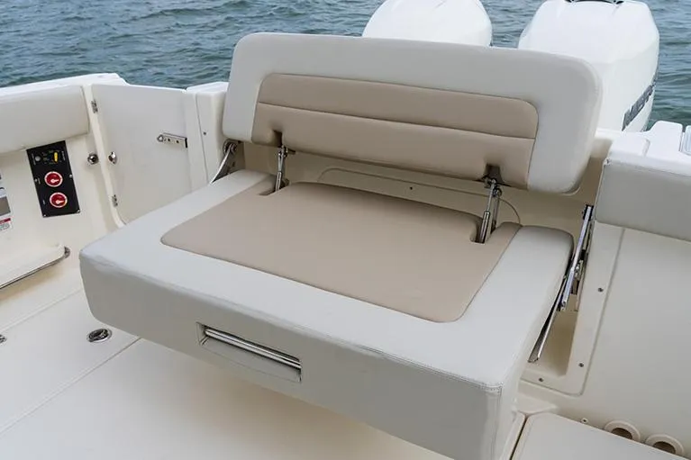 Slide: The Image of Manufacturer Provided Image: Boston Whaler 280 Vantage 2026 boat seat with beige and white upholstery. - 12
