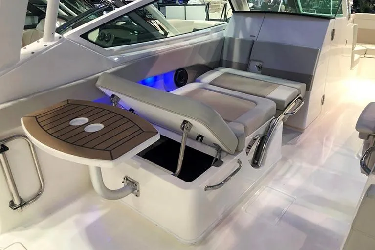 Slide: The Image of Manufacturer Provided Image: 2026 Boston Whaler 280 Vantage interior with seating and table, showcasing modern design. - 9