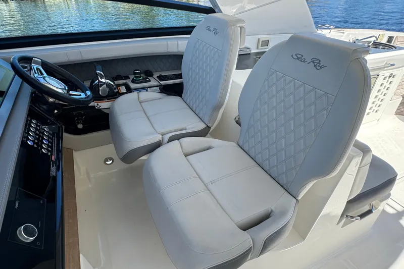 Slide: The Image of 2022 Sea Ray SLX 400 Outboard cockpit with luxurious seating and modern controls. - 39