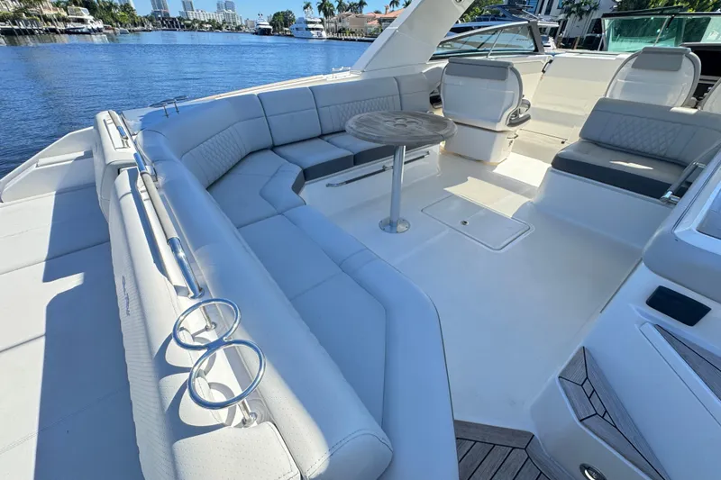 Slide: The Image of Luxurious 2022 Sea Ray SLX 400 Outboard boat interior with spacious seating and elegant design. - 13