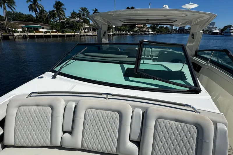 Slide: The Image of 2022 Sea Ray SLX 400 Outboard boat with luxurious seating and sleek design on the water. - 42