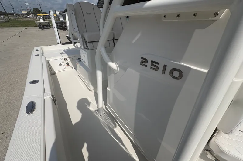 Slide: The Image of 2022 Ranger 2510 Bay boat interior with seating and model number visible. - 14
