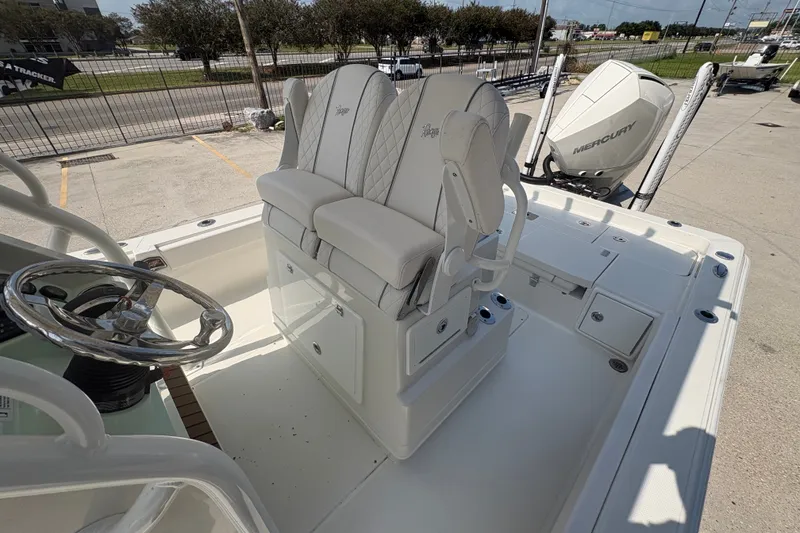 Slide: The Image of 2022 Ranger 2510 Bay boat interior with dual seats and steering wheel. - 17