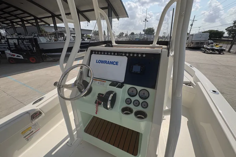 Slide: The Image of 2022 Ranger 2510 Bay boat console with steering wheel and Lowrance electronics. - 16