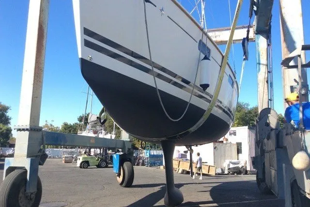 Slide: The Image of 2010 Jeanneau Sun Odyssey 42 DS sailboat in dry dock, undergoing maintenance. - 29
