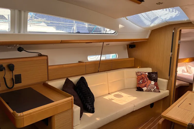 Slide: The Image of Interior of 2010 Jeanneau Sun Odyssey 42 DS yacht with cozy seating and modern design. - 2