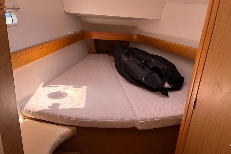 Slide: The Image of Cozy cabin interior of 2010 Jeanneau Sun Odyssey 42 DS with mattress and bag. - 7