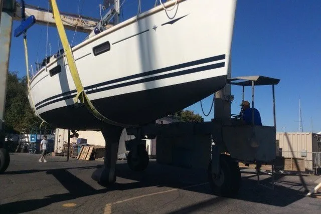 Slide: The Image of Jeanneau Sun Odyssey 42 DS 2010 sailboat being lifted at a marina. - 30
