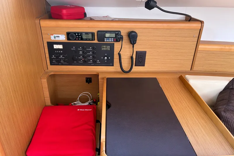 Slide: The Image of Navigation station of 2010 Jeanneau Sun Odyssey 42 DS yacht with control panel and equipment. - 9