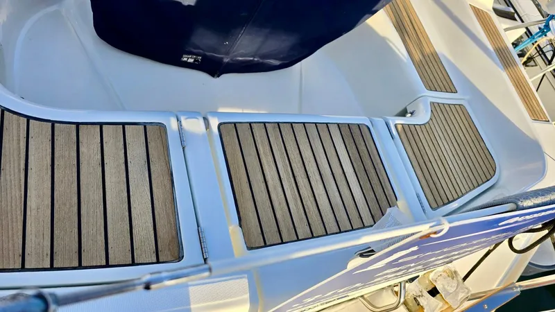 Slide: The Image of Teak deck of 2006 Beneteau 393 sailboat, showcasing elegant wood finish. - 10