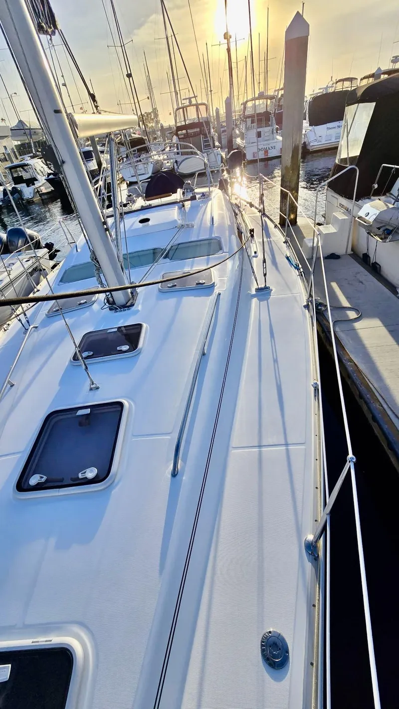 Slide: The Image of Sailing yacht Beneteau 393, 2006 model, docked at marina during sunset. - 12