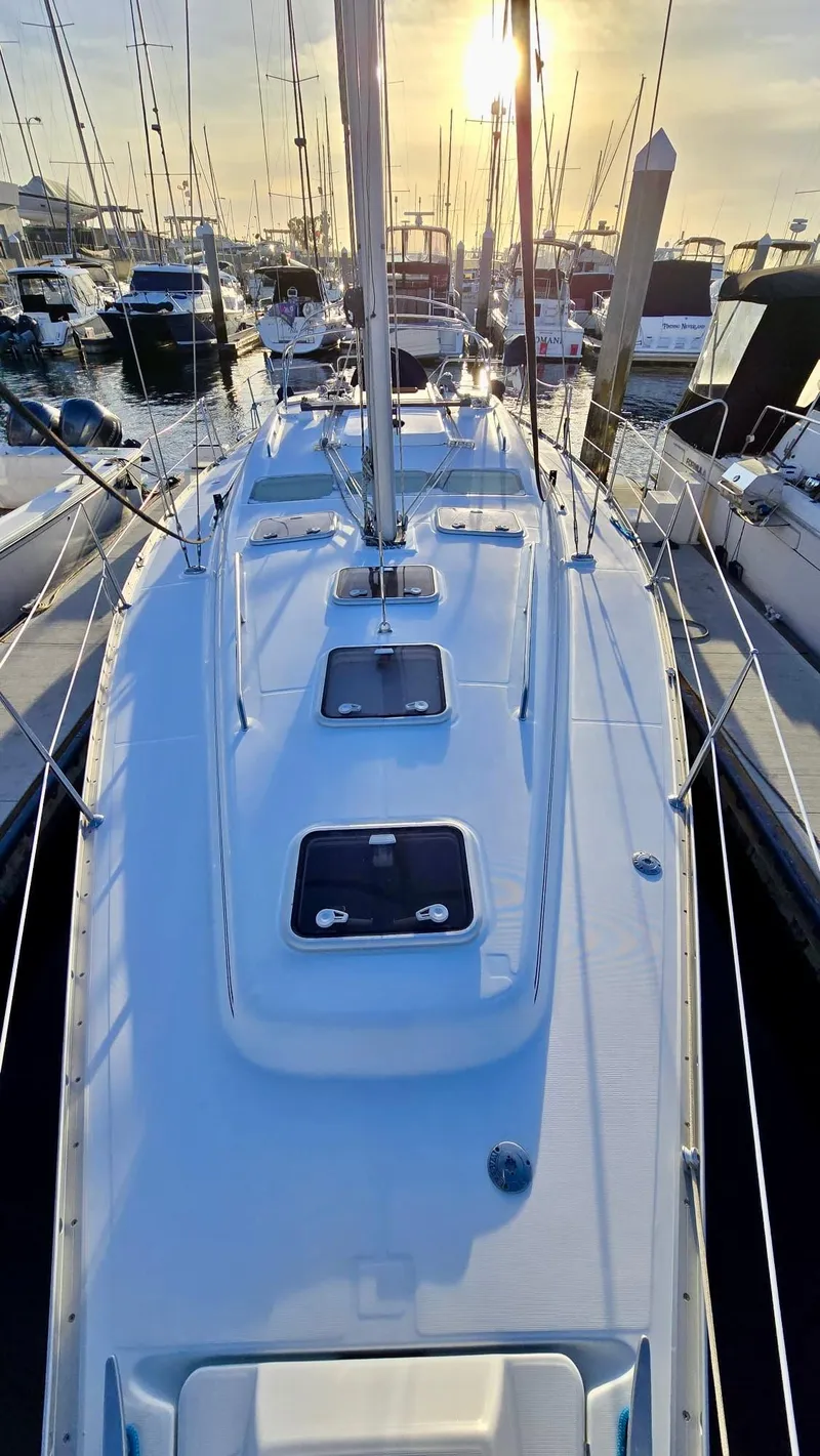 Slide: The Image of 2006 Beneteau 393 sailboat docked at marina during sunset. - 6