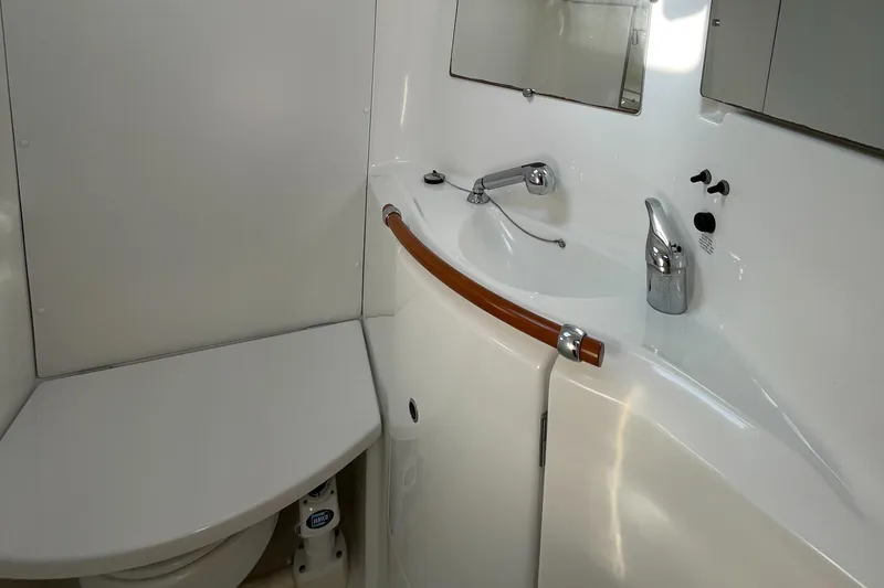 Slide: The Image of Bathroom interior of 2006 Beneteau 393 yacht with sink and toilet. - 30
