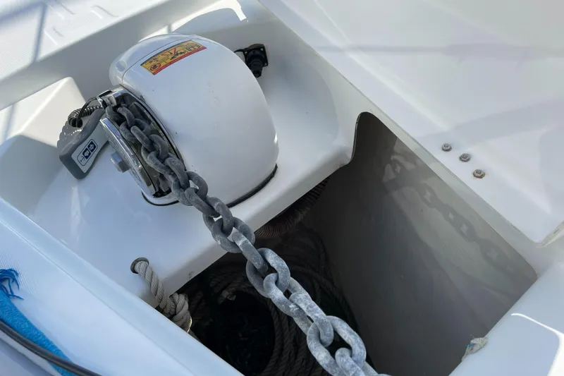 Slide: The Image of Anchor chain and windlass on a 2006 Beneteau 393 sailboat deck. - 20