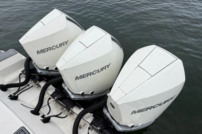 Slide: The Image of Triple Mercury outboard engines on a 2020 Sea Ray Sundancer 320 Coupe, docked on water. - 45