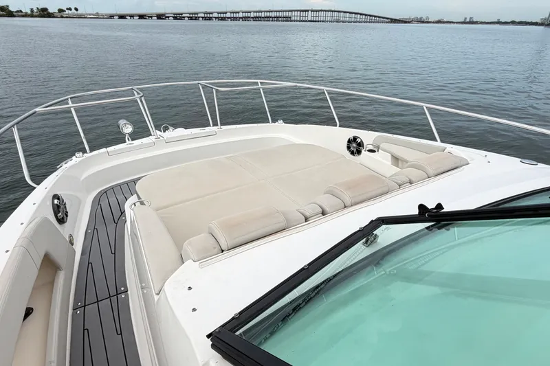 Slide: The Image of 2020 Sea Ray Sundancer 320 Coupe Outboard, spacious deck with seating, overlooking calm waters. - 35