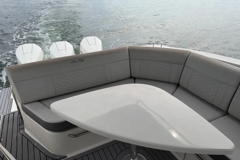 Slide: The Image of 2020 Sea Ray Sundancer 320 Coupe Outboard with elegant seating and table on deck. - 17