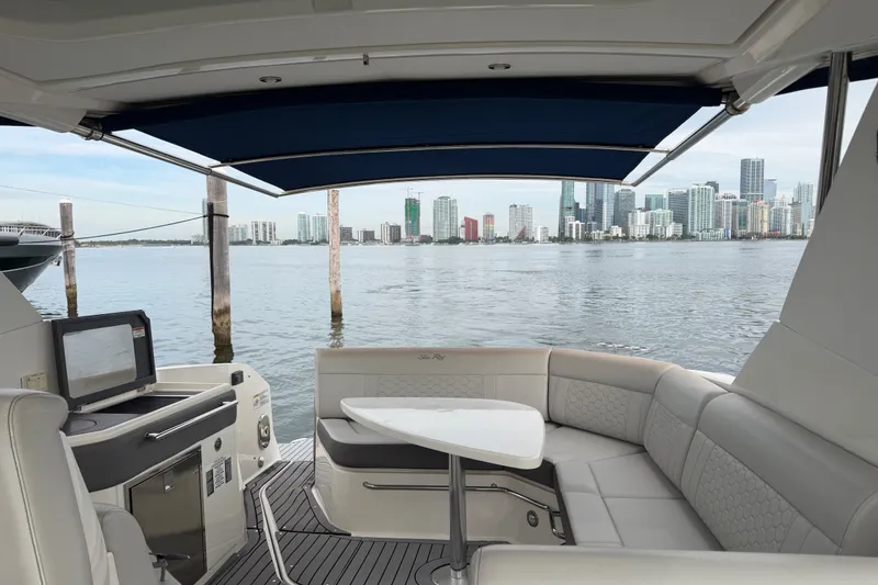 Slide: The Image of Interior view of 2020 Sea Ray Sundancer 320 Coupe Outboard with city skyline backdrop. - 44