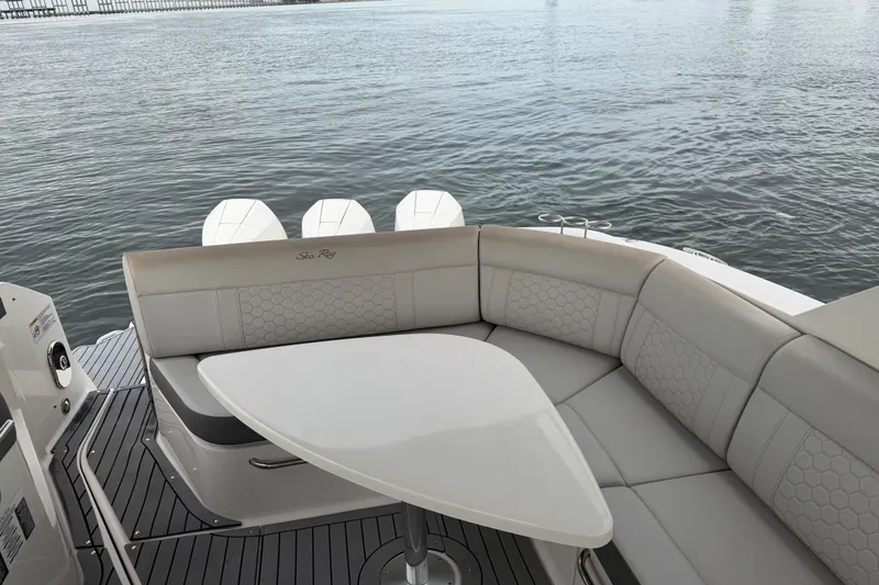Slide: The Image of 2020 Sea Ray Sundancer 320 Coupe Outboard with elegant seating and table on deck. - 16