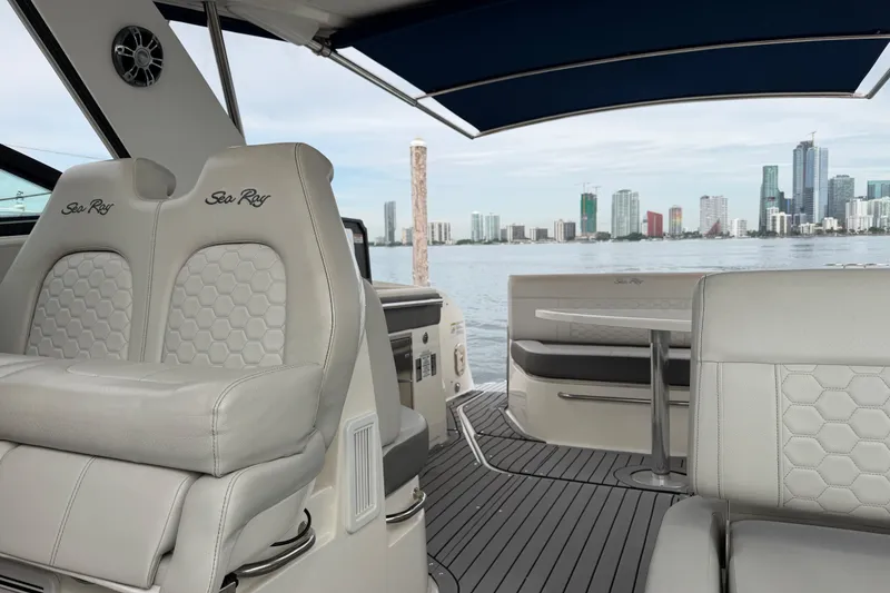 Slide: The Image of 2020 Sea Ray Sundancer 320 Coupe Outboard interior with city skyline view. - 43