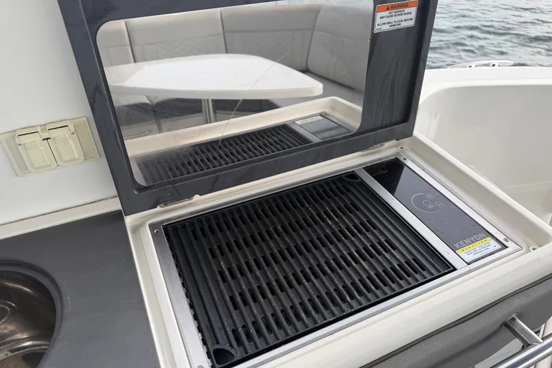 Slide: The Image of Outdoor grill on 2020 Sea Ray Sundancer 320 Coupe Outboard yacht, featuring sleek design. - 23