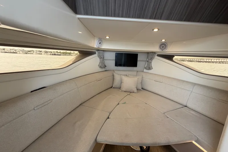 Slide: The Image of Luxurious interior of 2020 Sea Ray Sundancer 320 Coupe Outboard with plush seating and modern design. - 36
