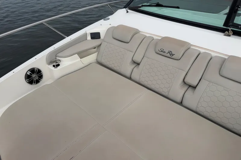 Slide: The Image of Luxurious seating on 2020 Sea Ray Sundancer 320 Coupe Outboard, featuring elegant beige upholstery. - 31