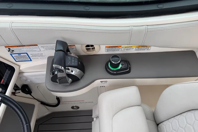 Slide: The Image of Control panel of a 2020 Sea Ray Sundancer 320 Coupe Outboard boat with throttle and joystick. - 9
