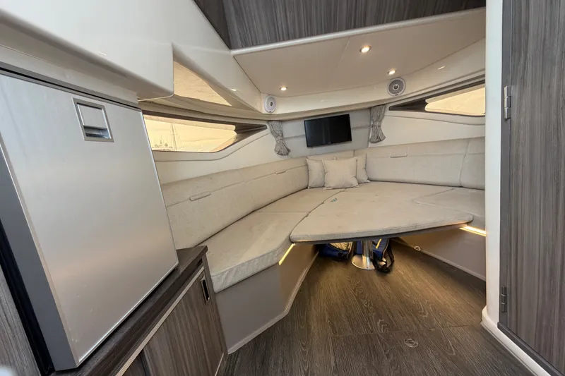 Slide: The Image of Interior of 2020 Sea Ray Sundancer 320 Coupe Outboard, featuring cozy seating and modern amenities. - 42