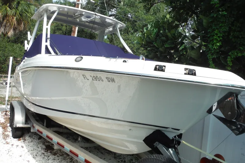 The Image of 2021 Boston Whaler 240 Vantage boat on trailer, parked outdoors. - 0