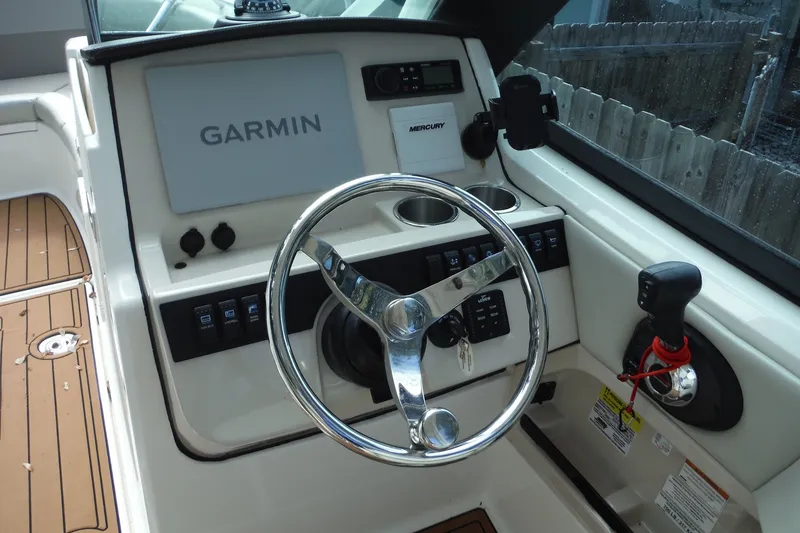 Slide: The Image of 2021 Boston Whaler 240 Vantage helm with Garmin navigation and Mercury controls. - 19
